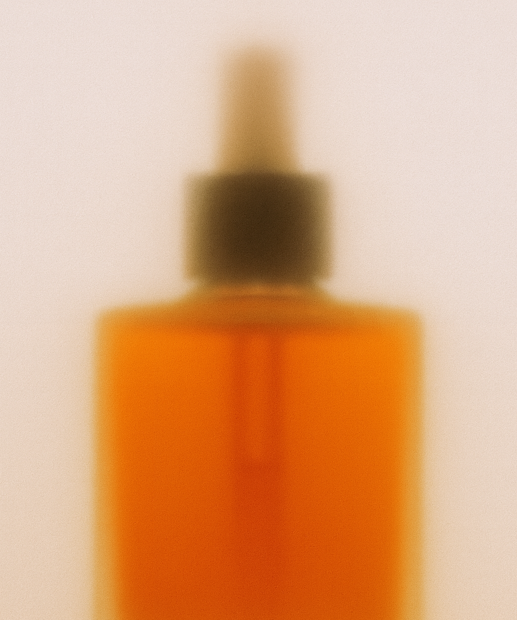 Warm-toned Oliba Cosmetics serum infused with royal jelly and rosehip seed oil — a luxurious natural formula for luminous, rejuvenated skin.