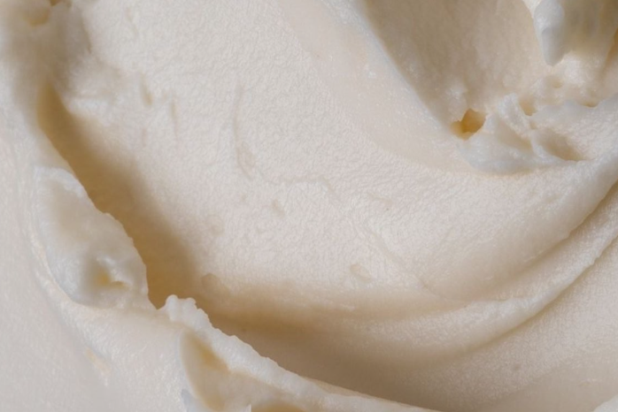 Pure beef tallow texture — nutrient-rich heritage ingredient in Oliba Cosmetics luxury skincare for deep moisture and repair.