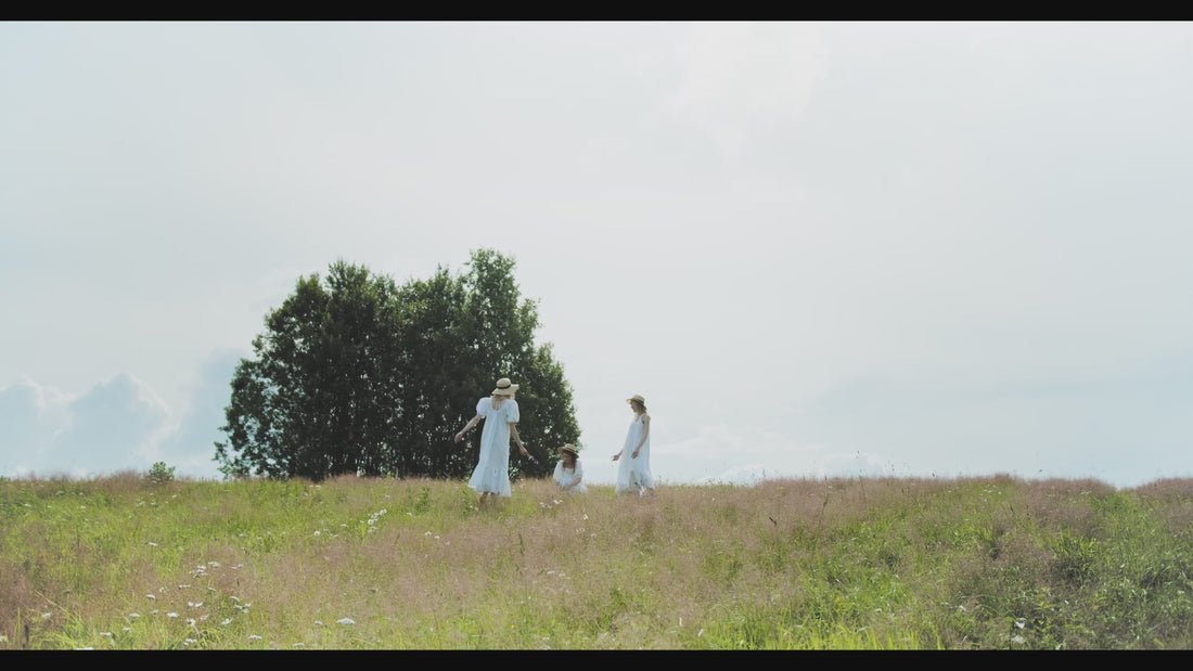 Girls dancing and picking flowers in nature for Oliba skincare campaign